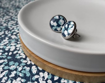 Leather studs in blue flower print. Blue earrings. Blue studs. Floral studs. Hypoallergenic surgical stainless steel bezel.