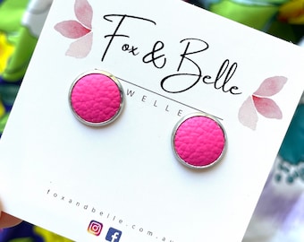 Leather studs in hot pink print. Hypoallergenic surgical stainless steel bezel. Pink earrings. Pink studs.