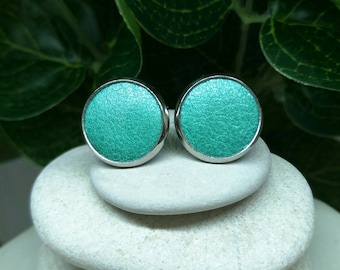 Leather studs in teal pearl print. Hypoallergenic surgical stainless steel bezel.