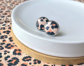 Leather studs in peach, tan and orange leopard print. Hypoallergenic surgical stainless steel bezel. Leopard earrings. Animal print earrings