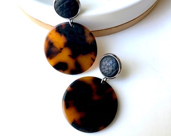 Leather earrings with 12mm black leather stud and tortoise shell resin disc. Stainless steel post. Hypoallergenic. Light weight earring.