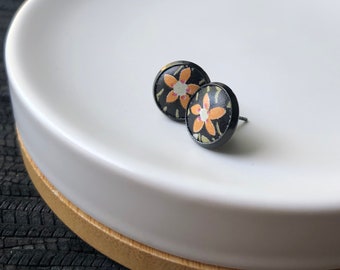 Black leather Studs with orange flowers. 10mm. Hypoallergenic surgical stainless steel bezel.