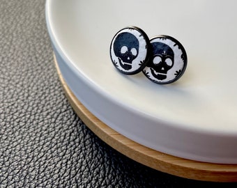 Leather studs in skull print. Halloween earrings. Skull earrings. Hypoallergenic surgical stainless steel bezel. Butterfly back.