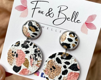 Large leather dangle earrings in pansies and leopard. Stainless steel post. Hypoallergenic. Light weight earring. 12mm stud.