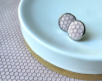 Leather studs in pink honeycomb print. White studs. Hypoallergenic surgical stainless steel.
