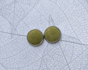 Leather studs in olive green suede print. Hypoallergenic surgical stainless steel bezel.