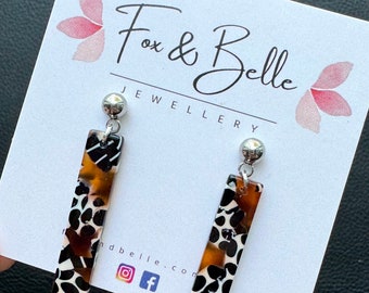 Resin earrings. Slim dangle studs in leopard. Leopard dangle earrings. Resin earrings.
