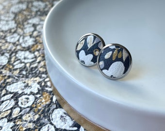 Leather studs in navy floral print. Hypoallergenic surgical stainless steel bezel. Butterfly back.