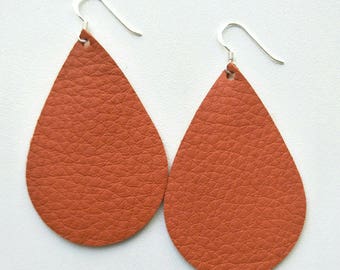 Leather Earrings- Tear Drop persimmon orange print. Hypoallergenic sterling silver hooks. Light weight earrings.