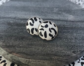 Leather studs in snow leopard print. Hypoallergenic surgical stainless steel bezel.