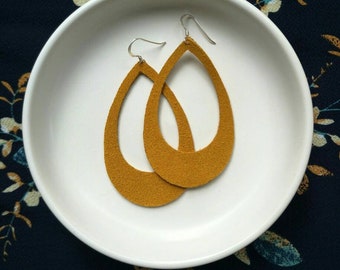 Leather Earrings- Silhouette mustard suede print. Hypoallergenic sterling silver hooks. Light weight earrings.