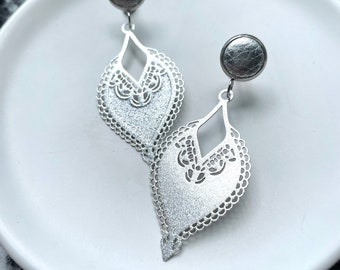 Silver filigree leaf earrings with 10mm leather stud. Hypoallergenic stainless steel. Butterfly back. Silver earrings.