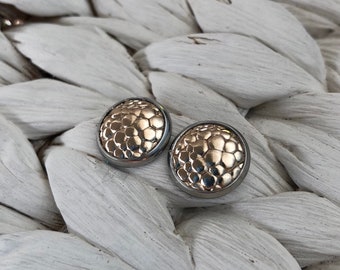 Leather studs in gold bubble print. Hypoallergenic surgical stainless steel bezel.