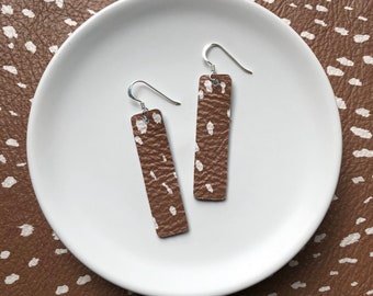 Leather earrings- Bar design in caramel splash print. Hypoallergenic sterling silver hooks. Light weight earrings.