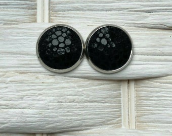 Leather studs in midnight black print. Hypoallergenic surgical stainless steel bezel.