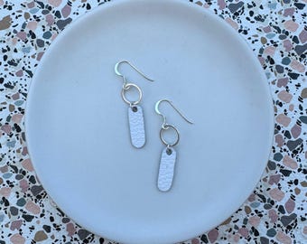 Dainty dangles in white. Leather dangle earrings. Light weight earrings. White earrings. Hoop earrings.