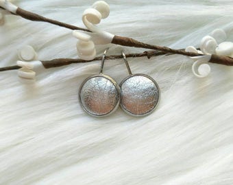 Leather Drop Studs in Silver. Hypoallergenic surgical stainless steel bezel.