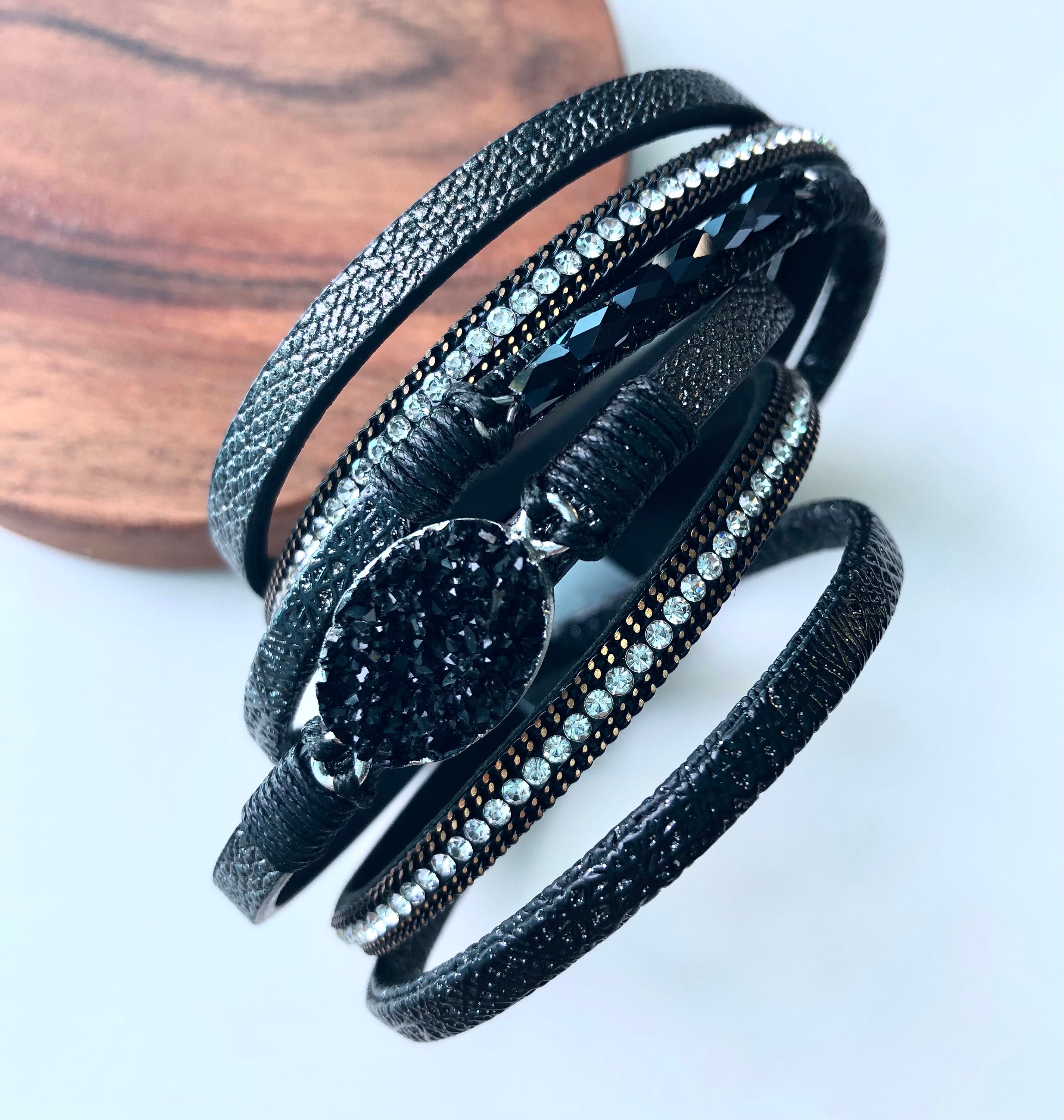 Leather bracelet in black with black stone. Multiple strand.