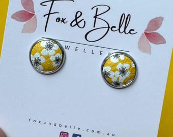 Leather studs in sunny day print. Yellow studs. Yellow earrings. Floral studs. Hypoallergenic surgical stainless steel bezel.