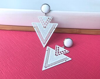 White filigree geometric earrings with 10mm leather stud. Hypoallergenic stainless steel. Butterfly back.
