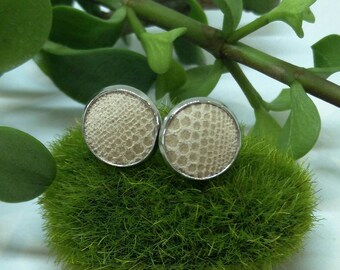 Leather studs in french vanilla print. Hypoallergenic surgical stainless steel.