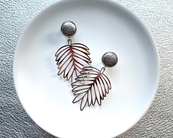 Silver tropical palm dangle earrings with 10mm leather stud. Hypoallergenic stainless steel. Silver dangle earrings. Butterfly back.