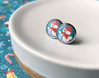 Leather studs in Snowman print. 12mm. Hypoallergenic surgical stainless steel bezel.