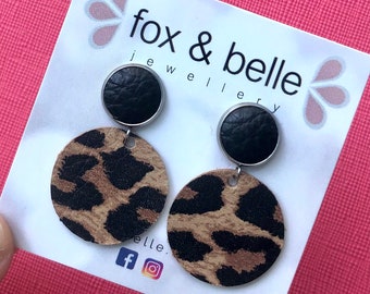 Large leather dangle earrings in leopard with black leather stud. Stainless steel post. Hypoallergenic. Light weight earring. 12mm stud.