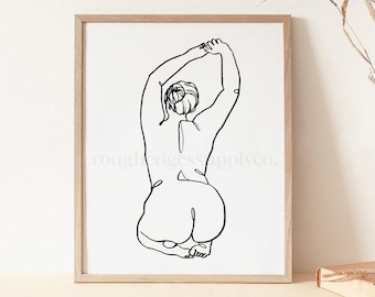 May include: A black and white line drawing of a person in a seated pose with their arms raised above their head. The drawing is on a white background and is framed in a light wood frame.