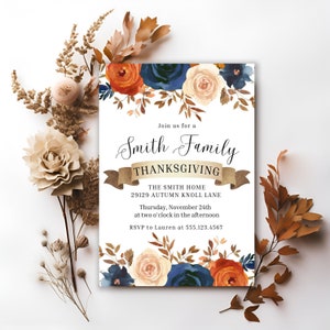 May include: A Thanksgiving invitation with a floral design in shades of orange, blue, and cream. The text reads "Join us for a Smith Family Thanksgiving, The Smith Home, 29129 Autumn Knoll Lane, Thursday, November 24th at two o'clock in the afternoon, RSVP to Lauren at 555.123.4567".