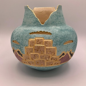 May include: A set of three ceramic mugs with a speckled, matte finish. The mugs are in shades of cream, light gray, and dark gray. Each mug has a simple, minimalist design, perfect for coffee or tea.