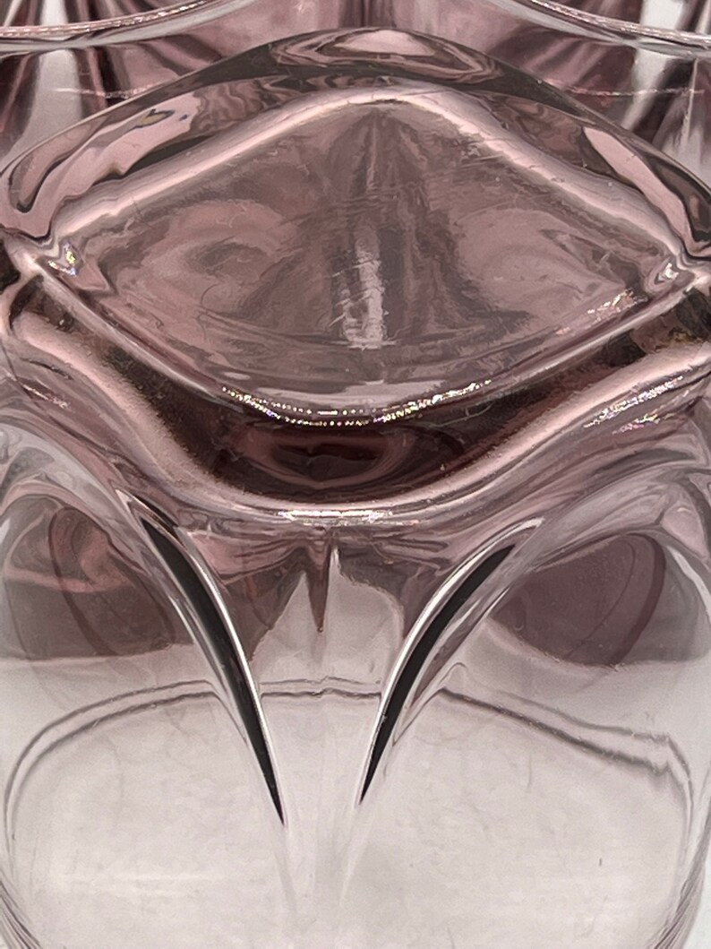 May include: A clear glass vase with a textured, wavy design. The vase is a deep purple color and has a gradient effect, fading to a lighter shade at the bottom.