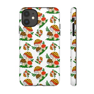 May include: A white phone case with a repeating pattern of red and yellow mushrooms on a green stem. The case has a black border and a cutout for the camera lens.