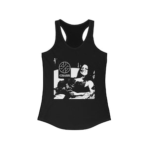 May include: Black racerback tank top featuring a black and white graphic. The graphic includes the word "CRASS" beneath a symbol and a black and white image of a person.