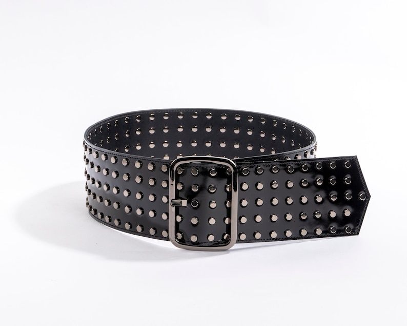 Wide 4″ (10cm) waist large buckle studded belt. Front view
