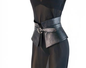 May include: A wide black corset-style belt featuring a smooth finish and a central buckle closure. The belt has a structured, tapered design that wraps around the waist, secured by a metal buckle with multiple adjustment holes for a custom fit.