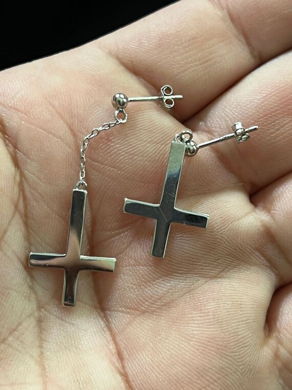 Anti cross earrings deals