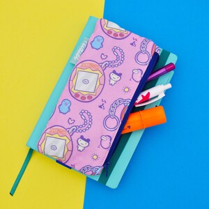 Astuccio imbottito portapenne con elastico per agende notebook bullet personalizzabile: gioco tama uovo,  giocattoli vintage, anni 80 e 90