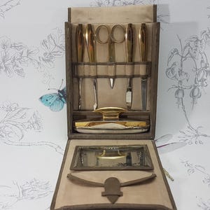 Vintage gilt metal manicure set in folding fabric case