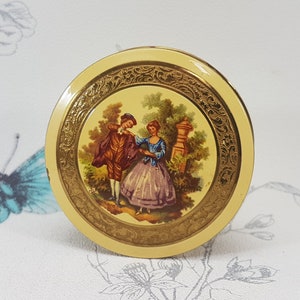 Vintage Colibri powder compact, gilt metal with enamel romantic scene to cover, vintage 1950s Colibri compact mirror