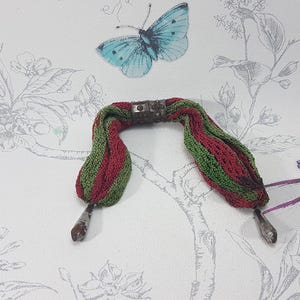 Antique crochet misers purse with cut steel finials and closers