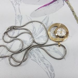 Vintage Medana Pendant Watch Necklace: Silver Tone Chain, Crescent Moon Detail