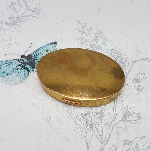 Vintage Mary Dunhill powder compact, oval brass compact mirror with original sifter and puff