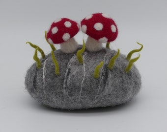Felted doorstop with felted stone and mushrooms