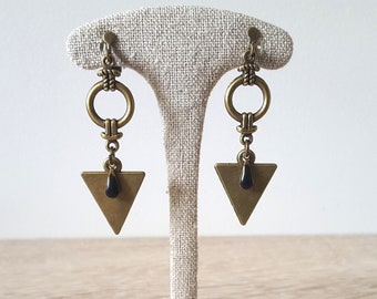 dangling clip earrings, ethnic and graphic style