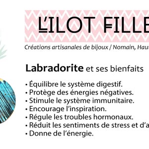 May include: A promotional graphic for L'ILOT FILLES featuring a pink flamingo illustration, the brand name, and a list of benefits for labradorite stone, including digestive balance, protection from negative energy, and immune system support.