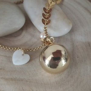 gold pregnancy bola with mother-of-pearl heart and freshwater pearl. image 1