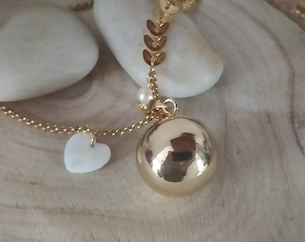 gold pregnancy bola with mother-of-pearl heart and freshwater pearl.