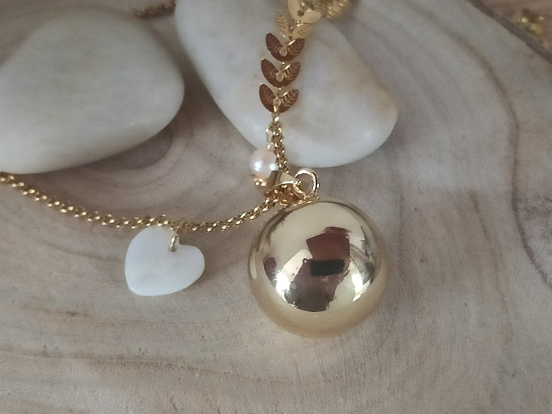 gold pregnancy bola with mother-of-pearl heart and freshwater pearl. image 1