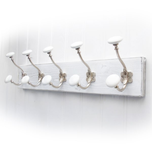 A Shabby Chic Distressed White Wooden Coat Rack with 5 White Ceramic Hooks